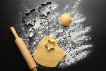 Raw dough for Christmas cookies on table