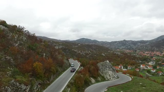 Beautiful Summer Mountain Road. Footage. A car travels along on a twisty mountain road. New winding road in the mountain