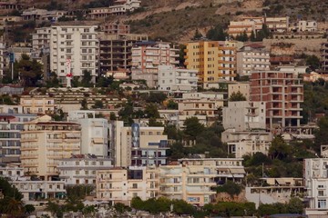 Ju ne 2014 - walls and windiws of buildings on the waterfront of City of Sarande, Albania, view...