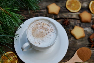 Cup of Cappuccino Beverage Wooden Background Pine Tree Concept of Christmas Top View Table Copy Space New Year Decorations 