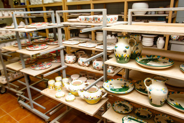 A pottery. A lot of different dishes that are ready for roasting.