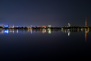 Obraz premium nightly panorama of Hamburg - Inner City with laser beam