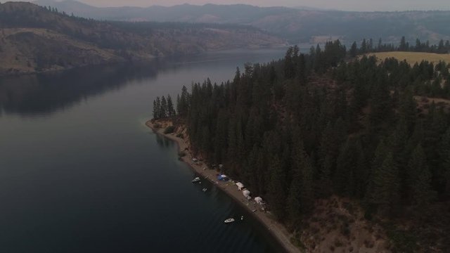 Drone Over Family Campground on Lake Beach in Forest