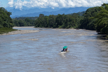 boats are used as a main transportation on river Napo in the Amazon area of the country
