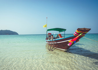 Obraz premium A boat is anchored at Bottle Beach, Koh Pha Ngan, Thailand