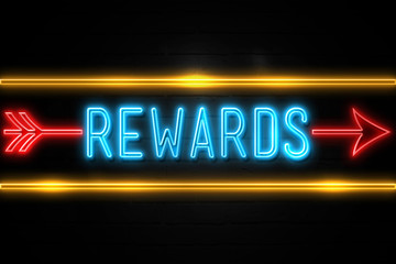 Rewards  - fluorescent Neon Sign on brickwall Front view
