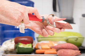 Sweet potato being pealed