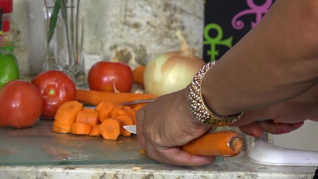 Slicing carrots close up
