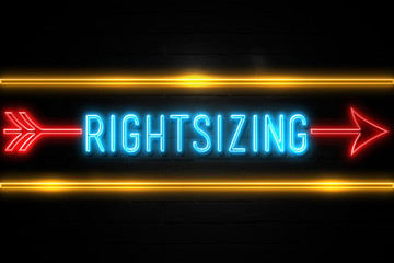 Rightsizing  - fluorescent Neon Sign on brickwall Front view
