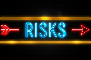 Risks  - fluorescent Neon Sign on brickwall Front view