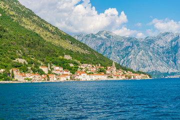 Fototapeta na wymiar Sailing on the yacht past the city of Perast in Montenegro.