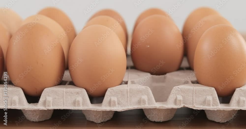 Canvas Prints Hand taking out eggs in the package