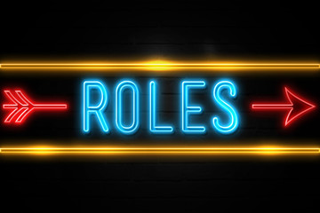 Roles  - fluorescent Neon Sign on brickwall Front view