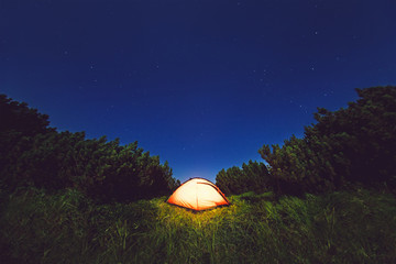 Camping under star sky in mountains
