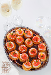 Salmon and creamcheese puffs . Pastries  and champagne. holiday