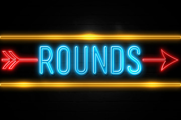Rounds  - fluorescent Neon Sign on brickwall Front view