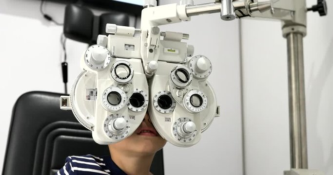 Little boy doing eye test in the clinic
