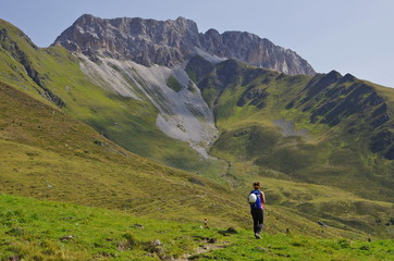 Young woman hiking in the Dolomites