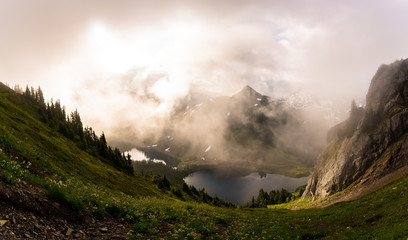 The magical light and clouds that drape the mountains of the North Cascades National Park can...