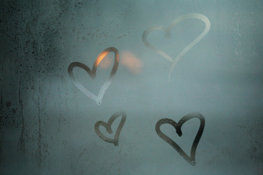 Hearts Drawn By Hand On A Glass Window