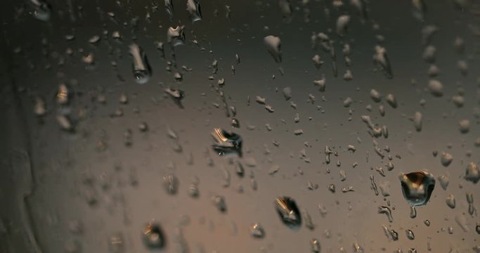 Rain drops running down a window