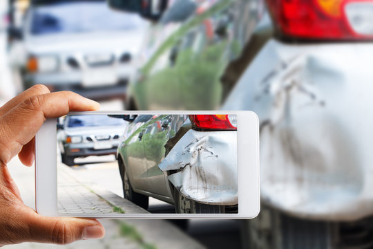 Car insurance agents take pictures of accident
