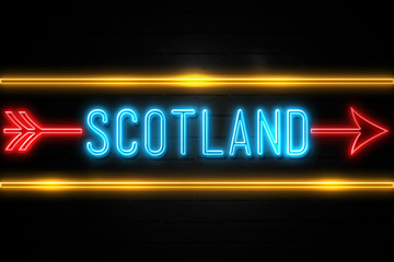 Scotland   - fluorescent Neon Sign on brickwall Front view