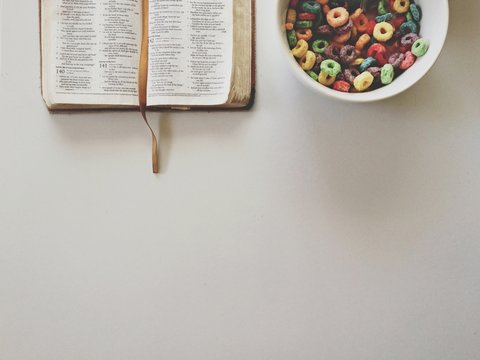 Breakfast with a bowl of cereal and bible