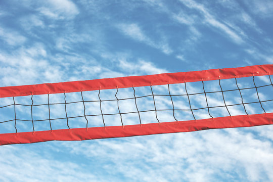 Volleyball net on a blue sky background.