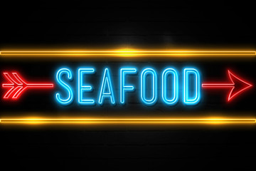 Seafood  - fluorescent Neon Sign on brickwall Front view