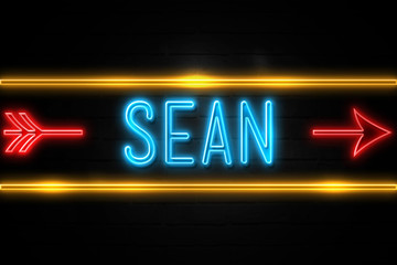 Obraz premium Sean - fluorescent Neon Sign on brickwall Front view
