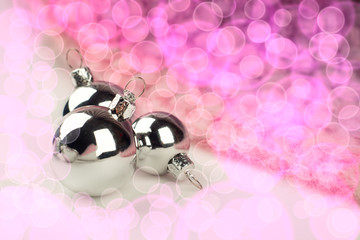 Obraz na płótnie Canvas Silver Christmas balls on shiny background
