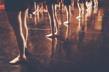 legs of young dancers ballerinas in class classical dance, ballet , Thailand , Color Black and...