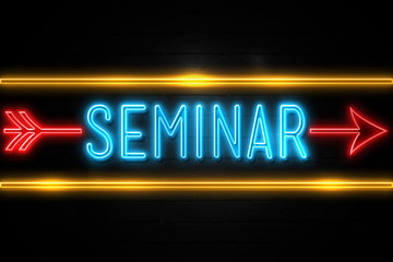 Seminar  - fluorescent Neon Sign on brickwall Front view