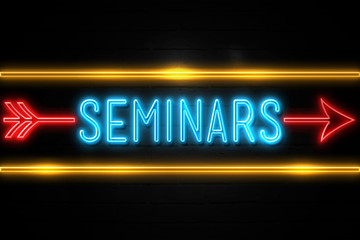 Seminars  - fluorescent Neon Sign on brickwall Front view