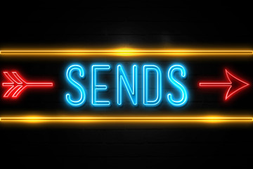 Sends  - fluorescent Neon Sign on brickwall Front view