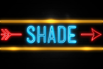 Shade  - fluorescent Neon Sign on brickwall Front view