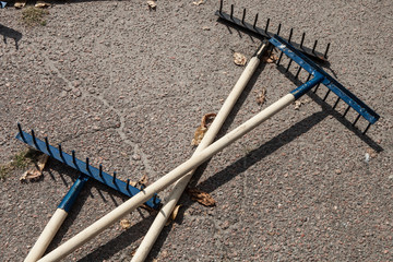 The rake spread out on the sidewalk
