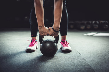 Woman working out with a kettlebell