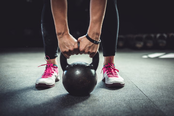 Woman working out with a kettlebell