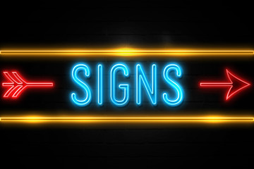 Fototapeta premium Signs - fluorescent Neon Sign on brickwall Front view