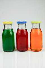 Fruit and vegetable juice bottles isolated on white background