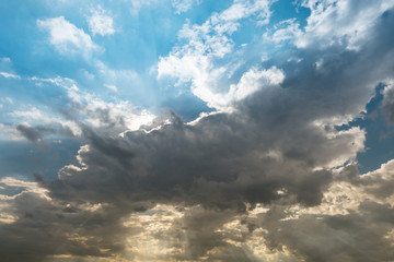 cloudy sky and blue clear sky clouds and sunburst or sun beam at twilight background