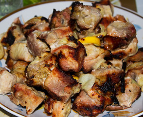 Grilled meat on a plate. Selective focus.
