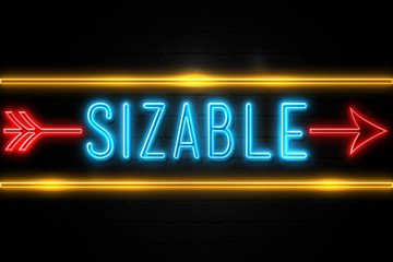 Sizable  - fluorescent Neon Sign on brickwall Front view