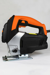 Electric jig saw on the light background