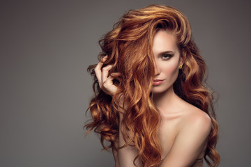 Portrait of woman with long curly beautiful ginger hair. - 170676812