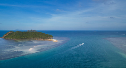 Aerial view of Thongsala bay Koh Phangan with boats in the clear blue sea