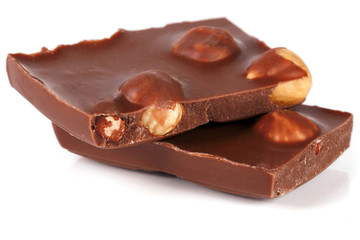 Chocolate with hazelnuts isolated on white background