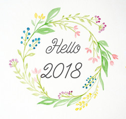 Hello 2018 on hand painting flowers wreath in watercolor style over white paper background, Sketch of flowers wreath new year greeting card